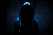 Woman Wearing Hoodie Hiding In The Dark,Scary Background For Book Cover