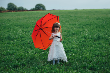 Wall Mural - little beautiful girl with bride dress