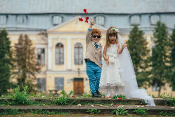 Canvas Print - two funny little bride and groom