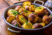 Potato. Roasted Potatoes. American Potatoes With Smoked Bacon Garlic Salt Pepper Cumin Dill Parsley - Herb Decoration.