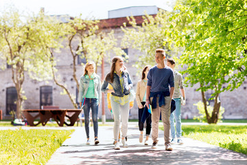 Poster - group of happy teenage students walking outdoors