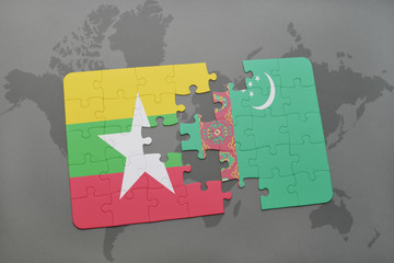 puzzle with the national flag of myanmar and turkmenistan on a world map background.