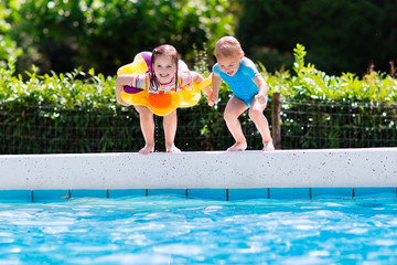 Wall Mural - Kids jumping into swimming pool