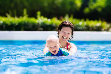 Wall Mural - Mother and baby in swimming pool