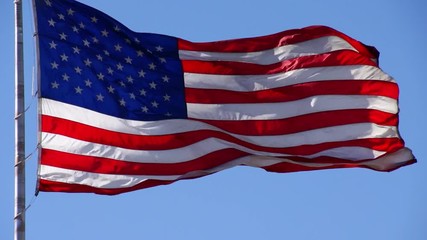 Wall Mural - us flag unfurling in the breeze. shot with a high-speed camera.