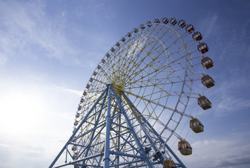 Ferris Wheel Over Blue Sky