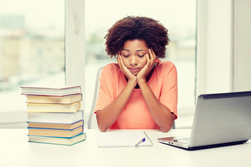 Canvas Print - bored african american woman doing homework home