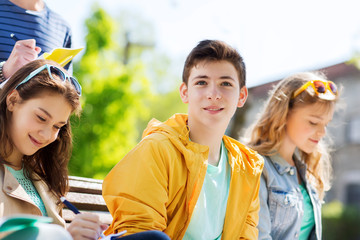 Canvas Print - group of students with notebooks at school yard