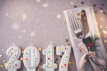 Wall Mural - Happy New Year 2017 table place setting, holidays copy space fairy light toning background