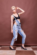 © DC Studio - Woman posing in fashion style in bra and jeans