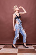 © DC Studio - Woman in jeans and bra posing in fashion style