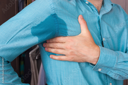 Fotomural Sweaty spot on the shirt because of the heat, worries and diffid