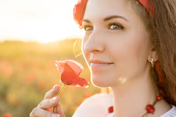 Ukrainian woman in the poppy field