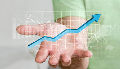 Aufkleber - Businessman holding digital charts bars and blue arrow