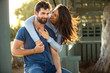 © elnariz - Beautiful engaged couple fiance hug and kiss good mood outside