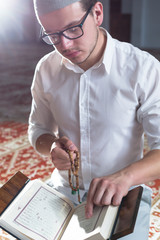 Wall Mural - Muslim Man Is Praying In The Mosque