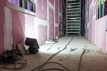 Floodlight light at building site illuminates long passage