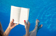© creativefamily - Girl reading by the swimming pool