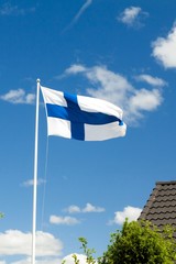 Wall Mural - Flag of Finland on blue sky background.