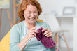 © Viacheslav Yakobchuk - Positive senior woman knitting