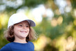 © Gelpi - Little cute girl with a cap in the park