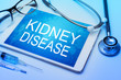 Kidney disease word on tablet screen with medical equipment on background