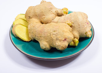 Fresh ginger isolated on white closeup.