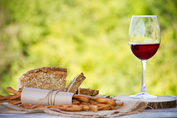 Wall Mural - Wine, bread and wheat on the wooden table