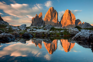 Tre Cime di Lavaredo with reflection in lake at sundown, Dolomit