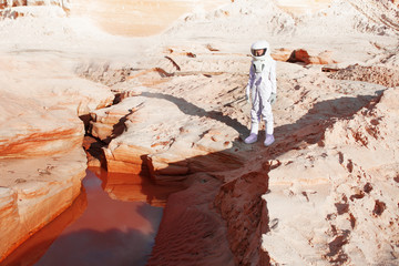 futuristic astronaut on another planet, mars. image with the effect of toning