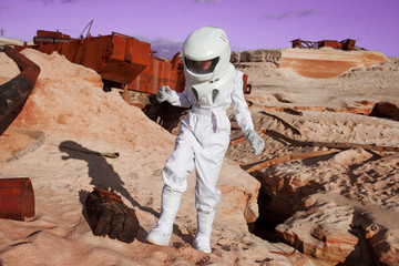 Wall Mural - futuristic astronaut on another planet, Mars. image with the effect of toning