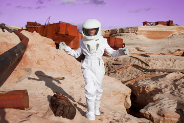 Wall Mural - futuristic astronaut on another planet, Mars. image with the effect of toning