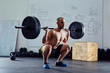 © baranq - Barbell squat exercise - athletic man during weightlifting worko