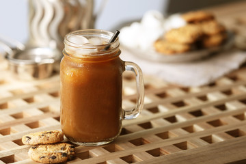 Poster - Iced coffee in glass jar and cookies on wooden table