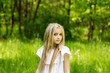 © Nadya Kolobova - Portrait cute blonde girl outdoors in summer