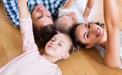 Wall Mural - Relaxed family of four posing