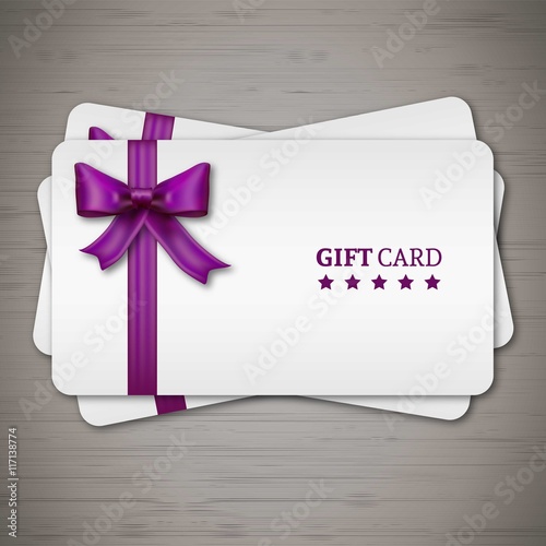Gift cards with purple ribbon © Freepik