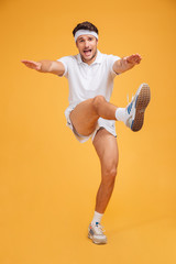 Sticker - Handsome young fitness man standing and doing exercises