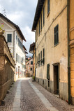 Fototapeta Uliczki - Facades of houses in a small street in the small mountain village Sassello in the north of Italy
