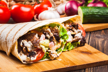 Tasty fresh wrap sandwich with beef and vegetables