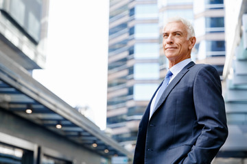 Portrait of confident businessman outdoors