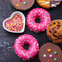 Colorful donuts on a grunge rusty table