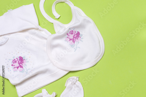 Clothes For Newborn Baby Girl On Light Green Background Copy