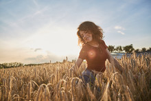 Happy Woman In Golden Wheat