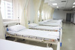 Hospital ward with beds and medical equipment