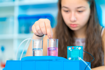 Poster - Girl schoolgirl experimenting hydrogen fuel cell