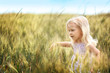 © Africa Studio - Little blonde girl in the field