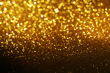 Wall Mural - black and gold glitter bokeh texture abstract background