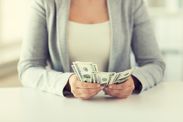 Poster - close up of woman hands counting us dollar money