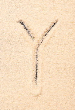 Y letter written on sand